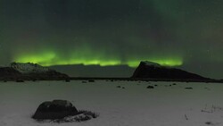 Northern Lights over the frozen Arctic fjord - solar storm Stock Footage