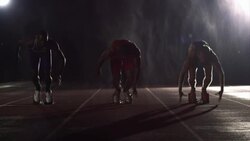 A group of runners take off from their starting positions and begin to race. Stock Footage