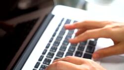 Closeup On Woman's Hand Typing On A Laptop Keyboard Stock Footage