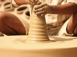 Man making a earthen pot on a pottery wheel, Faridabad, Haryana, India Stock Footage