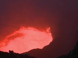 Volcanologist watches vigorously erupting lava lake, Marum Volcano, Ambrym Island, Vanuatu Stock Footage