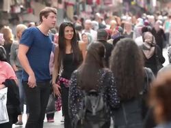 Young multinational tourist couple on crowded Istanbul street Stock Footage