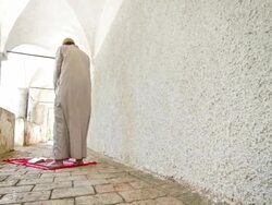 HD DOLLY: Muslim Man Praying At Mosque Corridor Stock Footage
