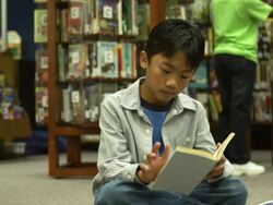 Children reading in Library Stock Footage