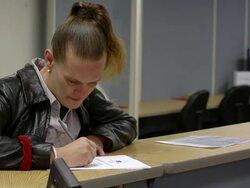 MS Woman filling form at counter for seeking job at state run job center / Jackson, Michigan, United States  Stock Footage
