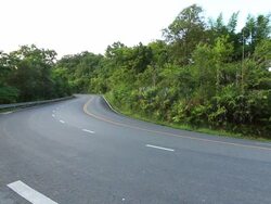 drive a motorcycle on mountainous road Stock Footage