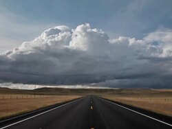 POV of empty Highway with dramatic clouds. Stock Footage
