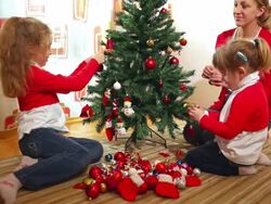 Family Decorating Christmas Tree Stock Footage