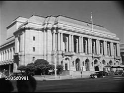1948: SAN FRANCISCO, CALIFORNIA: CULTURAL INSTITUTIONS: Angled WS War Memorial Opera House. MS People walking up/down steps of Opera, MS Poster for current season events. Instructional Video