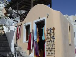 MS Shot of selling fabrics at shop in town / Oia, Santorini, Greece Stock Footage