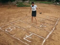 Businesswoman playing hopscotch, Haryana, India Stock Footage