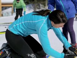 MS PAN TU Mom her girl getting ready for skiing skis in sunny winter day / Whistler, BC, Canada   Stock Footage