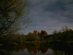 MS TL Stars moving over Cathedral Rock with creek / Sedona, Arizona, United States  Stock Footage