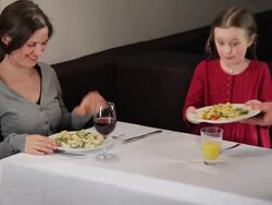 Mother and Daughter in Restaurant Stock Footage