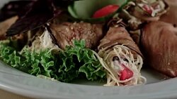 Cold starter. Eggplant rolls stuffed with grated cheese and tomatoes Stock Footage