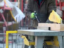 CU Worker Cutting Squared Lumber on Construction Site CU Stock Footage