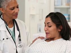 CU TU Doctor Coaching Pregnant Woman Through Labor Pains / Richmond, Virginia, USA Stock Footage