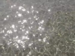 MS Shot of Reflecting sunlight on moving water / Forte dei Marmi, Tuscany, Italy Stock Footage