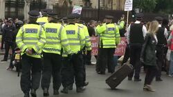 Police Officers Moving Anti-Austerity Protesters News Clip