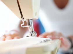 Entrepreneur fashion designer sewing machine Stock Footage
