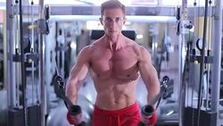 Man working out with resistance bands in gym Stock Footage