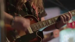 Bearded country singer in cowboy hat strums on guitar in Austin bar Stock Footage