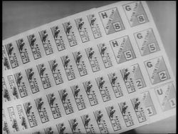 B/W 1940s close up sheet of ration stamps / World War II / newsreel Stock Footage
