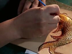 leatherworker paint  fish pattern on leather Stock Footage