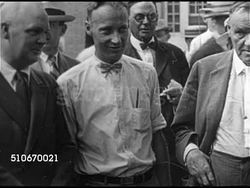 1925: SCOPES MONKEY TRIAL: Men walking past gate, MS Defense attorney Dudley Field Malone standing w/ biology teacher John Scopes & others, MS Men & John Scopes (proceeded by two of his ACLU attorneys) walking up steps of Rhea County Courthouse. Instructional Video