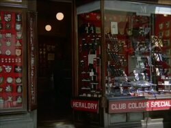 Heraldry on ties in shop, England, UK Stock Footage