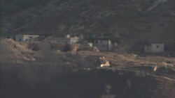 Plumes of smoke following shelling and clashes in Syria, filmed from across border News Clip