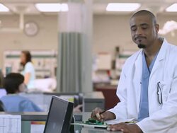 Male Doctor filling out forms Stock Footage