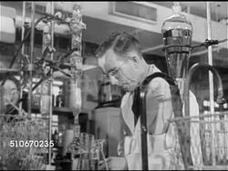 1920s: SCIENCE: VS Two male scientists working behind hanging tubes & beakers, HA WS Iconic small Northern or Midwest American town, VS Two children playing in  snow, boy skating down to ice to play hockey, Instructional Video
