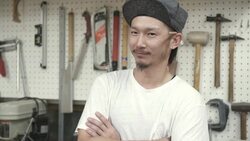 Craftsman standing against the wall Stock Footage