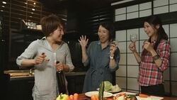 Three young women preparing food in the kitchen Stock Footage