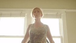 A mature woman works out in her home gym. Stock Footage