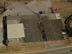 MS AERIAL Shot of company with parking area at Gaffney city / South Carolina, United States Stock Footage