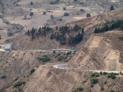 Mid of road cut into mountainside, Oruro mountain range, Bolivia Stock Footage