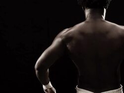 MS Studio shot of boxer stretching arms Stock Footage