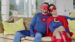 Superhero couple smiling on sofa Stock Footage