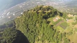 POV wingsuit flying close over tree tops Stock Footage