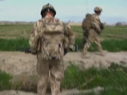 WS POV Soldiers walking in field / Musa Qala, Helmand Province, Afghanistan. Stock Footage