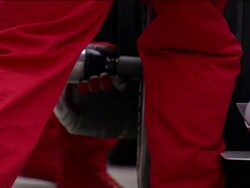 Low angle close up pit crew member holding lug gun / Formula One race car tire being changed Stock Footage