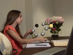 Latin Teen Learns Science by Studying Model of a Molecule Stock Footage