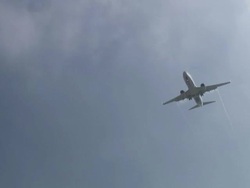 Silver and White Plane Overhead Stock Footage