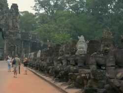 PAN Stone statues along entrance to Angkor Thom / Angkor, Cambodia Stock Footage
