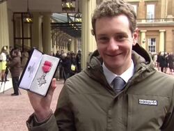 Alastair Brownlee Poses with MBE News Clip
