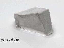 Cutting sodium metal with a scalpel. Stock Footage