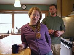 MS SLO MO Shot of Young organic farm couple having coffee in eclectic kitchen / Chatham, Michigan, United States Stock Footage
