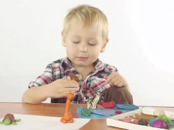 Boy sculpts from plasticine figurines Stock Footage